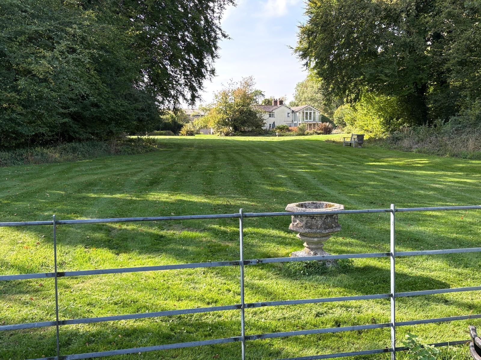 Country garden urn feature with surrounding planting